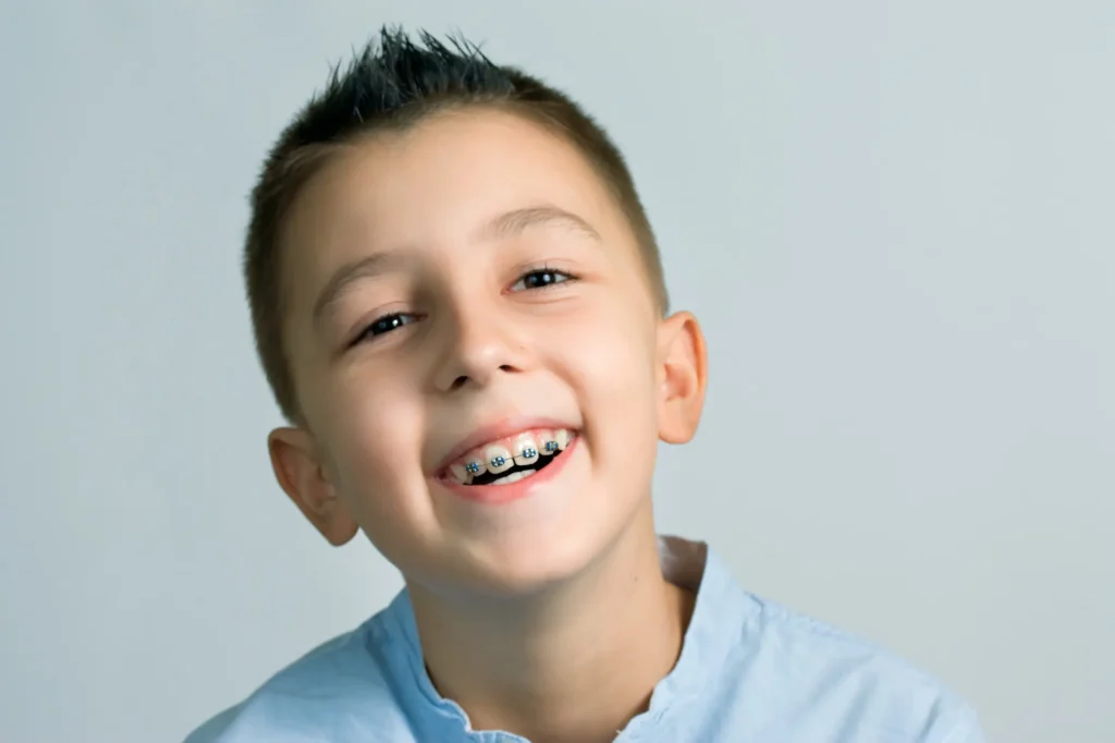Kids showing his teeth